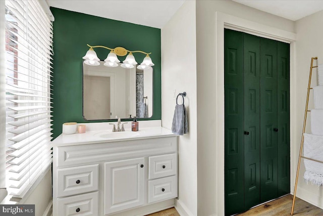 409 N Cherry St, Lancaster, PA 17602 - bathroom with a closet, plenty of natural light, vanity, and wood finished floors
