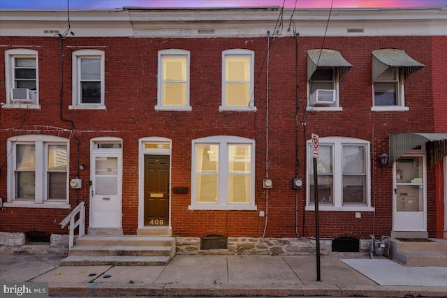 409 N Cherry St, Lancaster, PA 17602 - view of property featuring brick siding and cooling unit