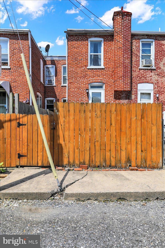 409 N Cherry St, Lancaster, PA 17602 - view of property exterior with brick siding and a chimney