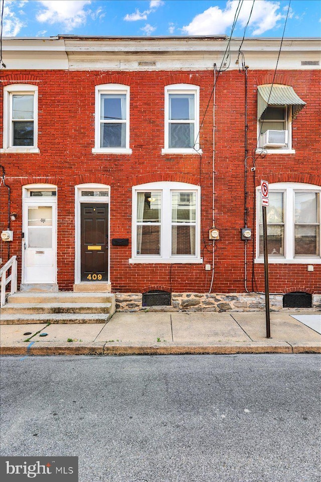 409 N Cherry St, Lancaster, PA 17602 - townhome / multi-family property with brick siding and cooling unit