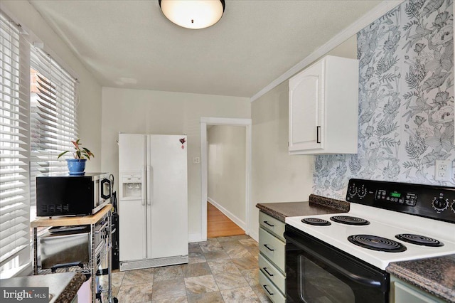 409 N Cherry St, Lancaster, PA 17602 - kitchen featuring white refrigerator with ice dispenser, electric stove, stainless steel microwave, dark countertops, and stone finish flooring