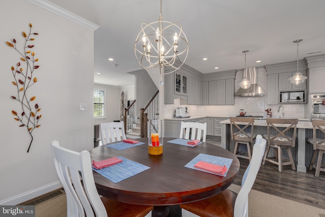 18 S Roberts Rd, Bryn Mawr, PA 19010 - dining room with recessed lighting, stairs, a chandelier, dark wood-type flooring, and crown molding