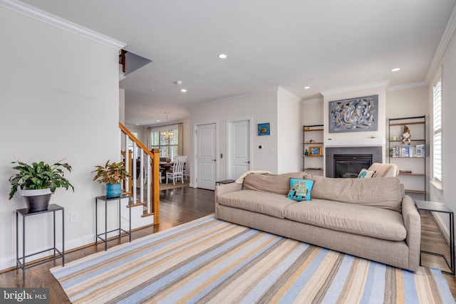18 S Roberts Rd, Bryn Mawr, PA 19010 - living room featuring stairway, wood finished floors, recessed lighting, a glass covered fireplace, and crown molding