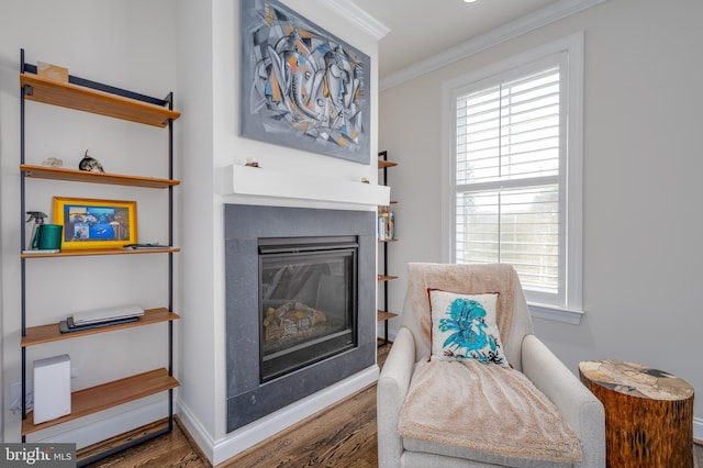 18 S Roberts Rd, Bryn Mawr, PA 19010 - sitting room featuring ornamental molding, wood finished floors, a glass covered fireplace, and healthy amount of natural light