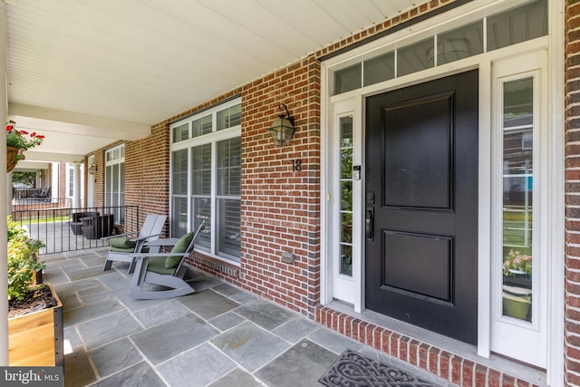 18 S Roberts Rd, Bryn Mawr, PA 19010 - doorway to property with covered porch and brick siding