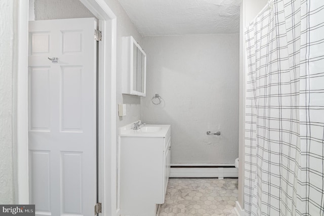 422 N High St, Duncannon, PA 17020 - bathroom featuring a baseboard heating unit, vanity, a textured ceiling, tile patterned floors, and curtained shower