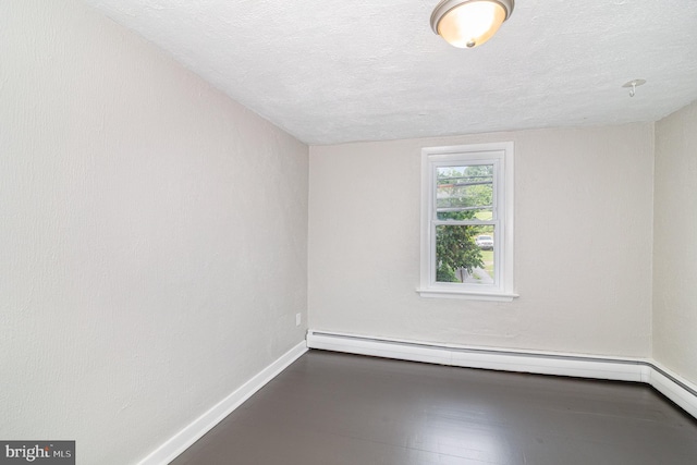 422 N High St, Duncannon, PA 17020 - spare room with a textured ceiling and a baseboard radiator