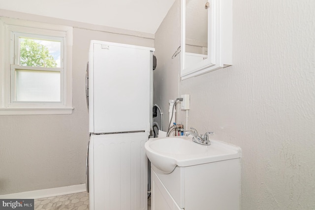422 N High St, Duncannon, PA 17020 - washroom with stacked washing machine and dryer and baseboards