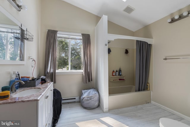39 Roxeter Rd, New Castle, DE 19720 - bathroom featuring a baseboard heating unit, vanity, wood finished floors, shower / bath combination with curtain, and vaulted ceiling