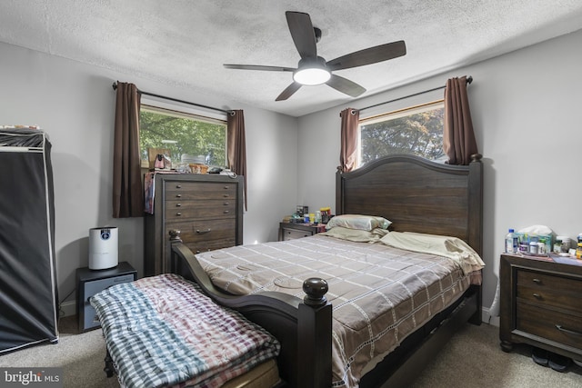 39 Roxeter Rd, New Castle, DE 19720 - carpeted bedroom with a textured ceiling and ceiling fan