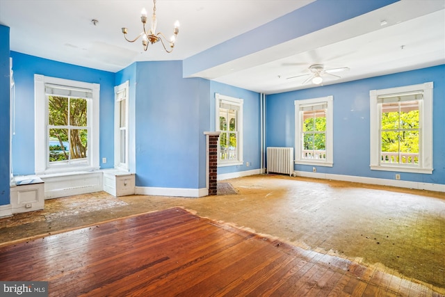 209 E Broad St, Falls Church, VA 22046 - spare room featuring radiator, a chandelier, hardwood / wood-style flooring, ceiling fan, and a pendent fire sprinkler