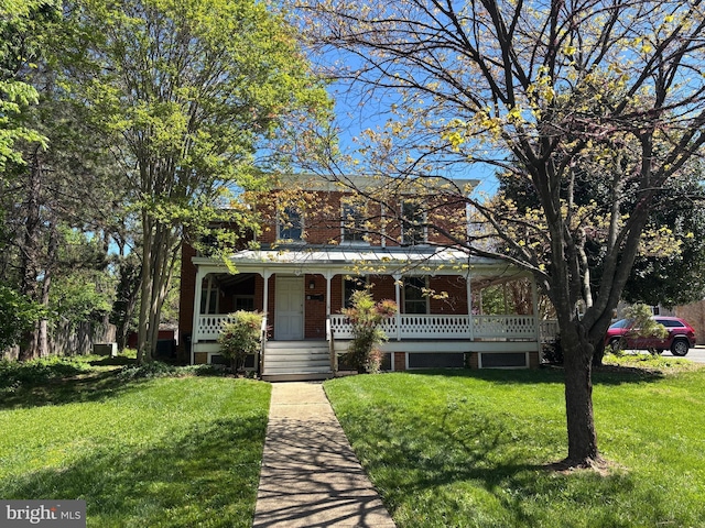 209 E Broad St, Falls Church, VA 22046 - view of front of home with a porch, brick siding, and a front yard