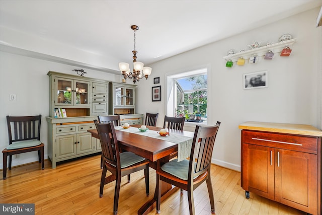 904 Hyde Rd, Silver Spring, MD 20902 - dining space with a chandelier and light wood finished floors