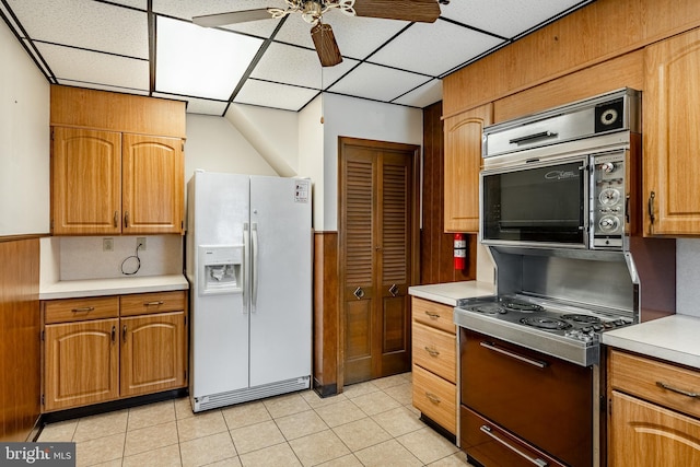1212 Astor St, Norristown, PA 19401 - kitchen featuring white refrigerator with ice dispenser, a ceiling fan, a paneled ceiling, range with electric stovetop, and light countertops
