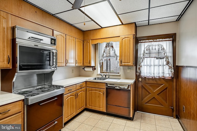 1212 Astor St, Norristown, PA 19401 - kitchen featuring dishwashing machine, range with electric stovetop, light countertops, plenty of natural light, and a paneled ceiling