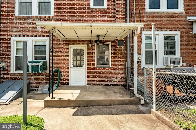 1212 Astor St, Norristown, PA 19401 - doorway to property featuring brick siding and cooling unit