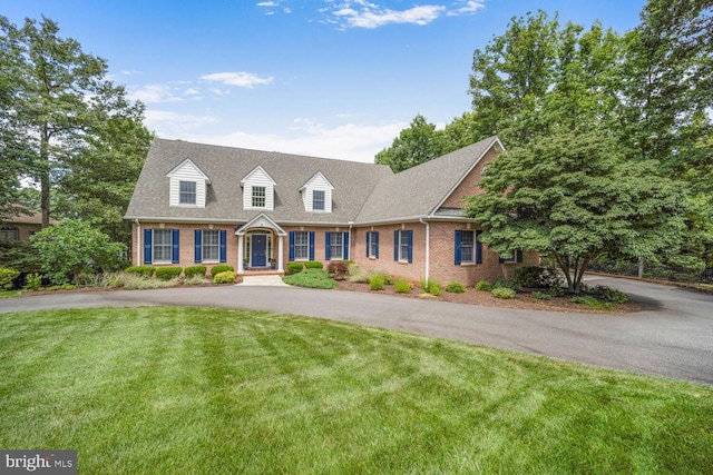 11203 Field Cir, Spotsylvania, VA 22551 - cape cod house featuring brick siding, a front lawn, and asphalt driveway