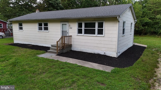 1414 Osborne Dr, Port Norris, NJ 08349 - view of front facade with roof with shingles and a front lawn