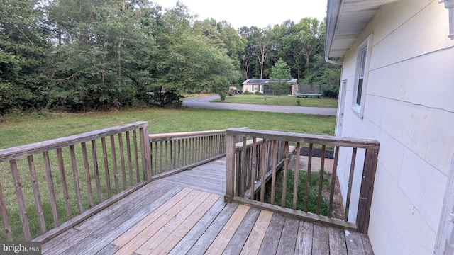 1414 Osborne Dr, Port Norris, NJ 08349 - wooden terrace with a lawn and a trampoline