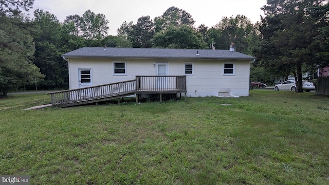 1414 Osborne Dr, Port Norris, NJ 08349 - back of property featuring a wooden deck, a yard, a shingled roof, and a chimney