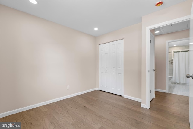 423 Highmeadow Rd, Reisterstown, MD 21136 - unfurnished bedroom featuring wood finished floors, recessed lighting, and a closet