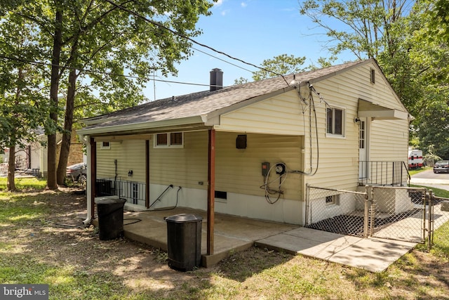 423 Highmeadow Rd, Reisterstown, MD 21136 - rear view of property with a gate and a shingled roof
