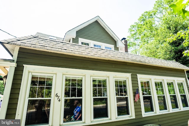 674 Good Intent Rd, Blackwood, NJ 08012 - view of side of property featuring roof with shingles and a chimney