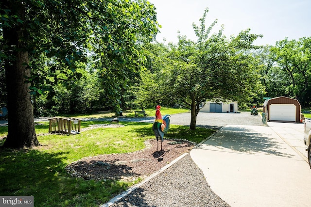 674 Good Intent Rd, Blackwood, NJ 08012 - view of green lawn with an outbuilding, driveway, and a garage