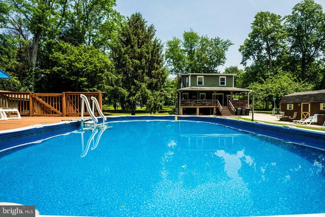 674 Good Intent Rd, Blackwood, NJ 08012 - swimming pool with a deck, view of scattered trees, an outbuilding, and stairs