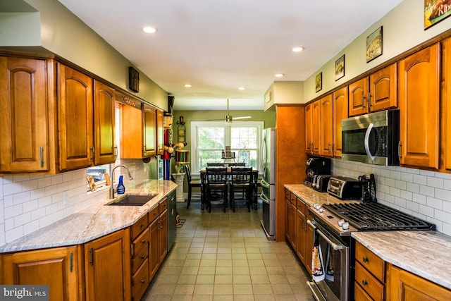 674 Good Intent Rd, Blackwood, NJ 08012 - kitchen with appliances with stainless steel finishes, light stone counters, decorative backsplash, recessed lighting, and brown cabinets