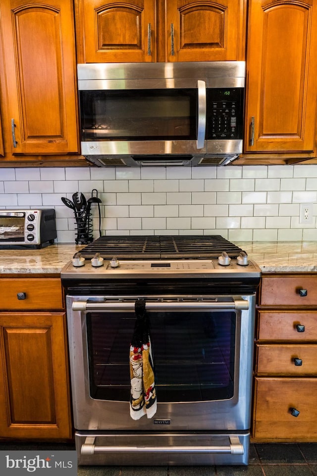 674 Good Intent Rd, Blackwood, NJ 08012 - kitchen featuring appliances with stainless steel finishes, brown cabinetry, and backsplash