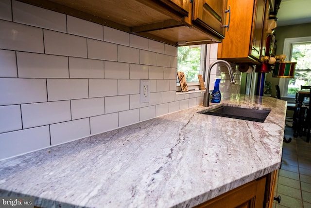 674 Good Intent Rd, Blackwood, NJ 08012 - kitchen with brown cabinetry, tasteful backsplash, and light stone counters
