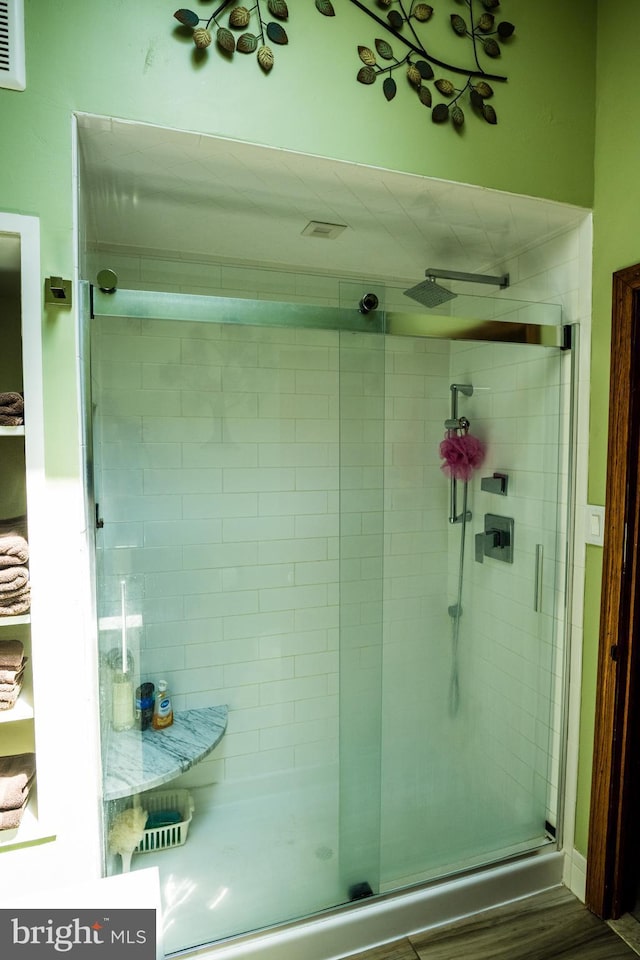 674 Good Intent Rd, Blackwood, NJ 08012 - bathroom featuring a stall shower and wood finished floors