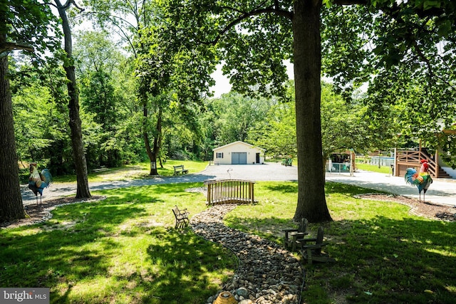 674 Good Intent Rd, Blackwood, NJ 08012 - view of green lawn featuring an outdoor structure, a playground, and a garage