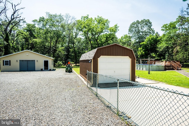 674 Good Intent Rd, Blackwood, NJ 08012 - detached garage featuring view of wooded area and driveway