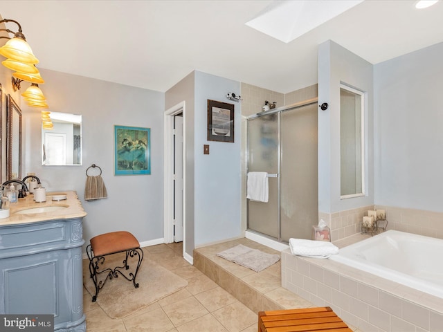 6108 Fieldcrest Dr, Frederick, MD 21701 - bathroom with a skylight, a shower stall, a garden tub, vanity, and tile patterned floors