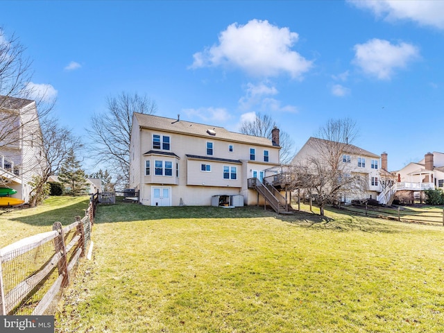 6108 Fieldcrest Dr, Frederick, MD 21701 - back of property featuring stairway, a wooden deck, a chimney, and a residential view