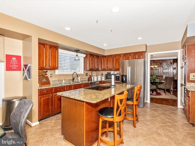 6108 Fieldcrest Dr, Frederick, MD 21701 - kitchen with stainless steel fridge, black electric stovetop, a kitchen breakfast bar, a kitchen island, and light tile patterned floors