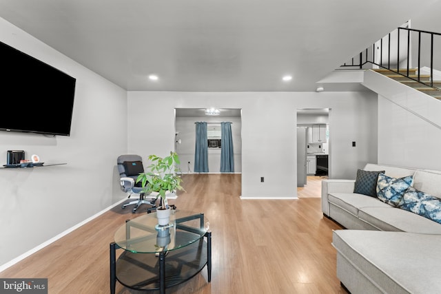 1922 Brookdale Rd, Baltimore, MD 21244 - living area featuring wood finished floors, stairway, and recessed lighting