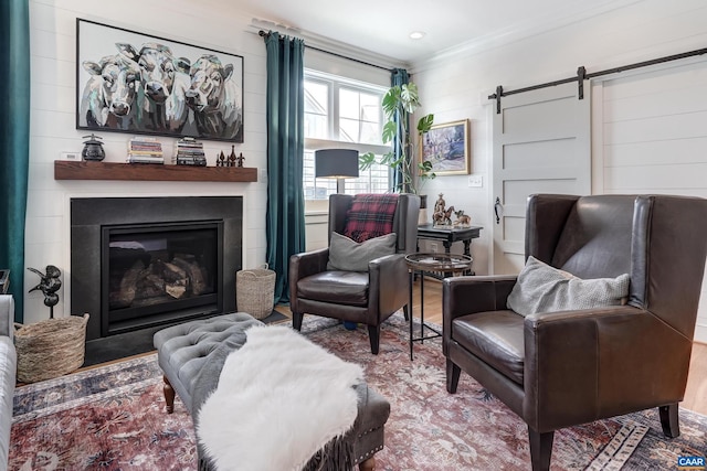 772 Golf View Dr, Crozet, VA 22932 - sitting room featuring a barn door, crown molding, a fireplace, and wood finished floors
