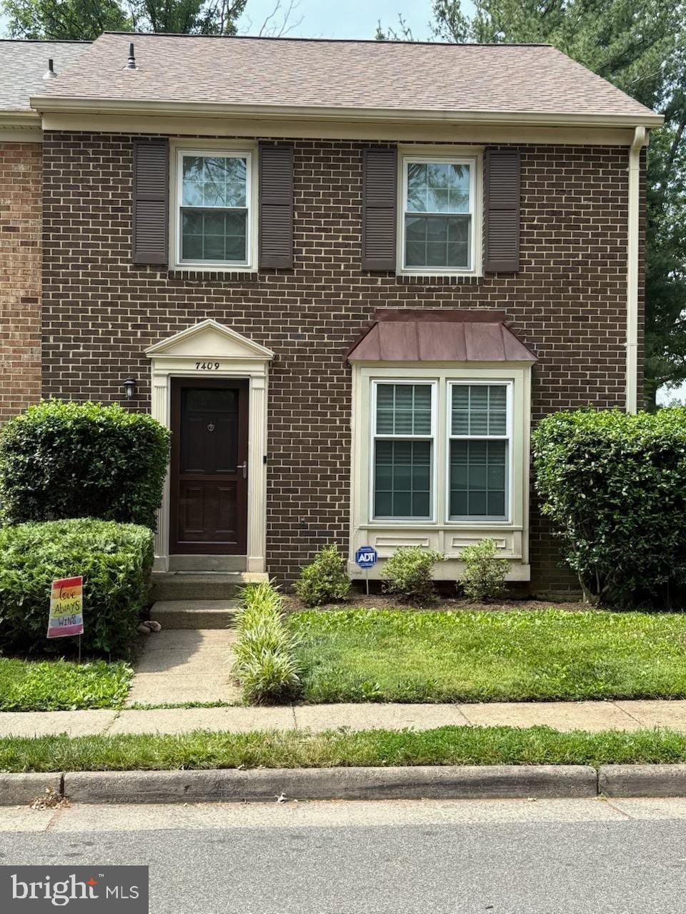 7409 Adams Park Ct, Annandale, VA 22003 - view of front facade with brick siding and a shingled roof