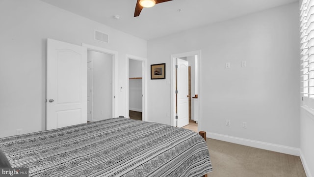 904 Joseph Johnson Dr, Annapolis, MD 21401 - bedroom with light carpet, a ceiling fan, a walk in closet, and ensuite bath