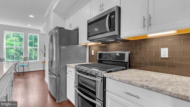 904 Joseph Johnson Dr, Annapolis, MD 21401 - kitchen featuring stainless steel appliances, ornamental molding, white cabinetry, light stone counters, and recessed lighting