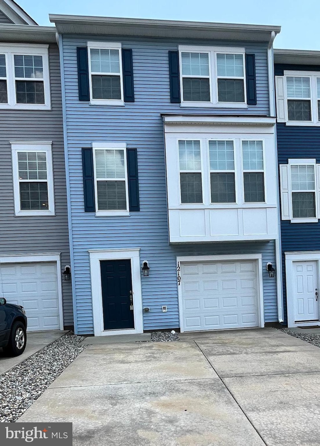12107 Bowling Farm Ct, Fredericksburg, VA 22407 - townhome / multi-family property featuring driveway and an attached garage