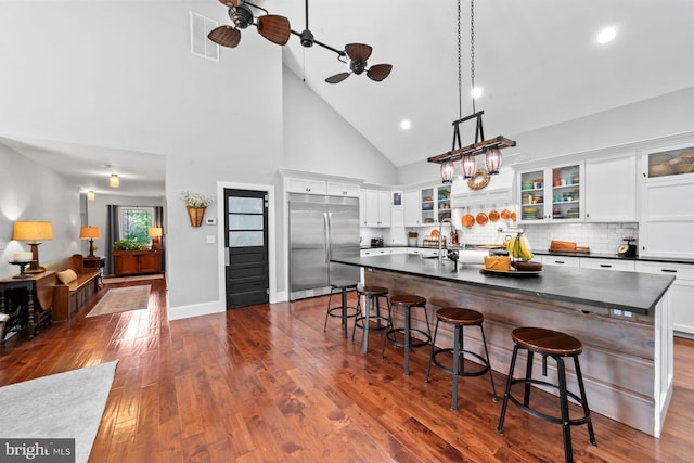 65 Shady Brook Ln, Princeton, NJ 08540 - kitchen featuring built in refrigerator, dark countertops, a ceiling fan, high vaulted ceiling, and white cabinetry