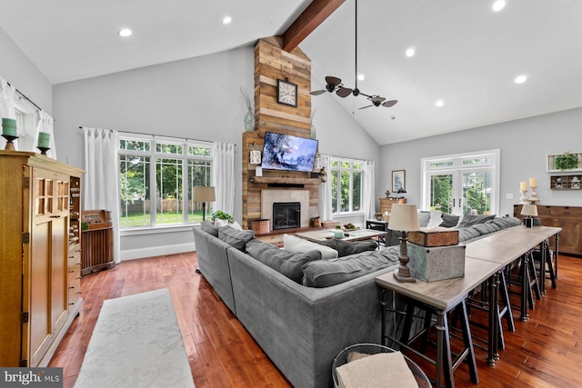65 Shady Brook Ln, Princeton, NJ 08540 - living room with high vaulted ceiling, beamed ceiling, ceiling fan, a fireplace, and wood finished floors