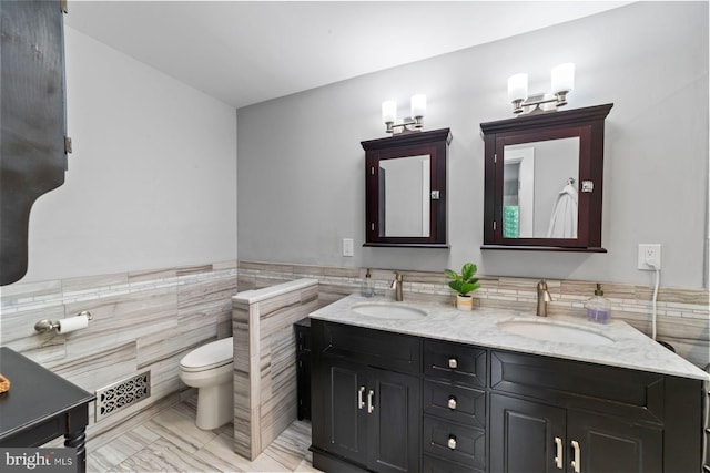 65 Shady Brook Ln, Princeton, NJ 08540 - bathroom featuring tile walls, double vanity, and a wainscoted wall