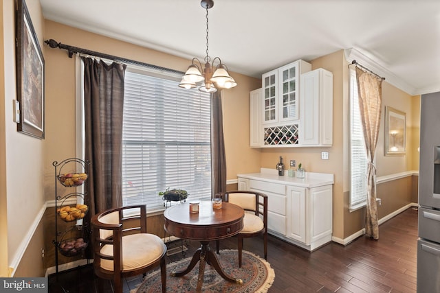 25336 Ripleys Field Dr, Chantilly, VA 20152 - dining area with dark wood-style flooring and a chandelier
