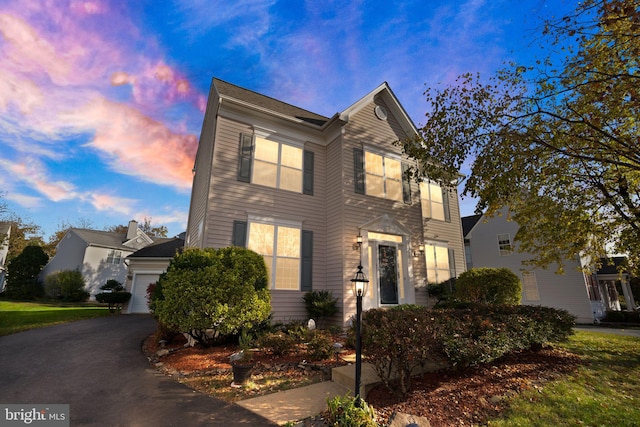 25336 Ripleys Field Dr, Chantilly, VA 20152 - traditional home featuring asphalt driveway and an attached garage