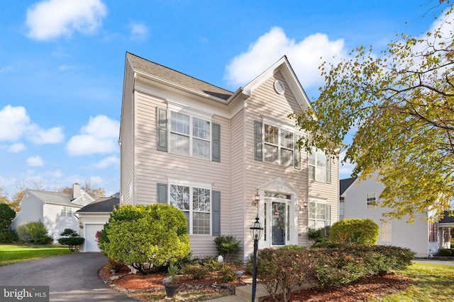 25336 Ripleys Field Dr, Chantilly, VA 20152 - traditional-style home with an attached garage and asphalt driveway